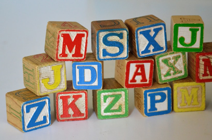 Wooden alphabet blocks spelling out letters
