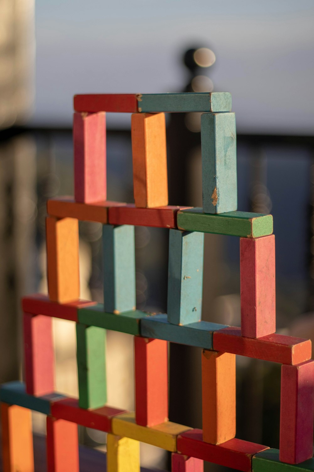 Colorful wooden building blocks stacked into a tower