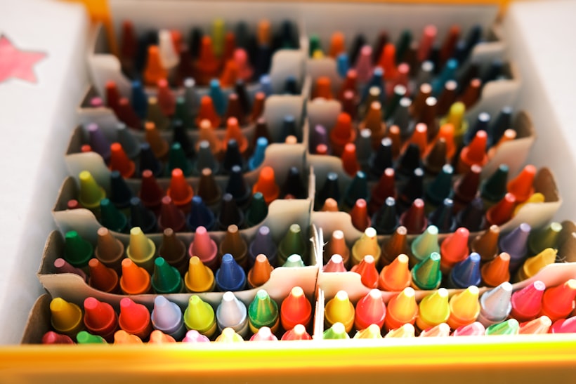 A box of brightly colored crayons